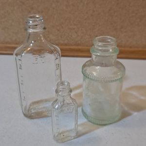 Adorable trio of old vintage glass bottles